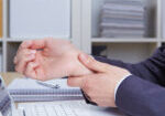 Hands,Of,Woman,With,Carpal,Tunnel,Syndrome,Over,Computer,Keyboard