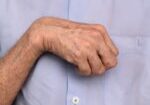 Hand,Muscle,Rigidity,And,Finger,Flexion,Of,Asian,Elder,Man.