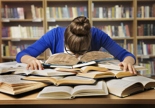 Student,Studying,Hard,Exam,And,Sleeping,On,Books,,Tired,Girl